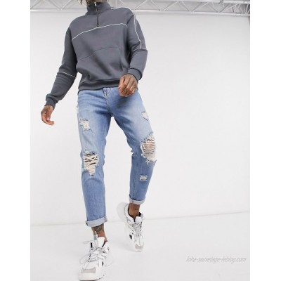  DESIGN tapered carrot jeans in vintage light wash with heavy rips  