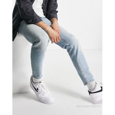  DESIGN tapered jeans in vintage light wash with rip  